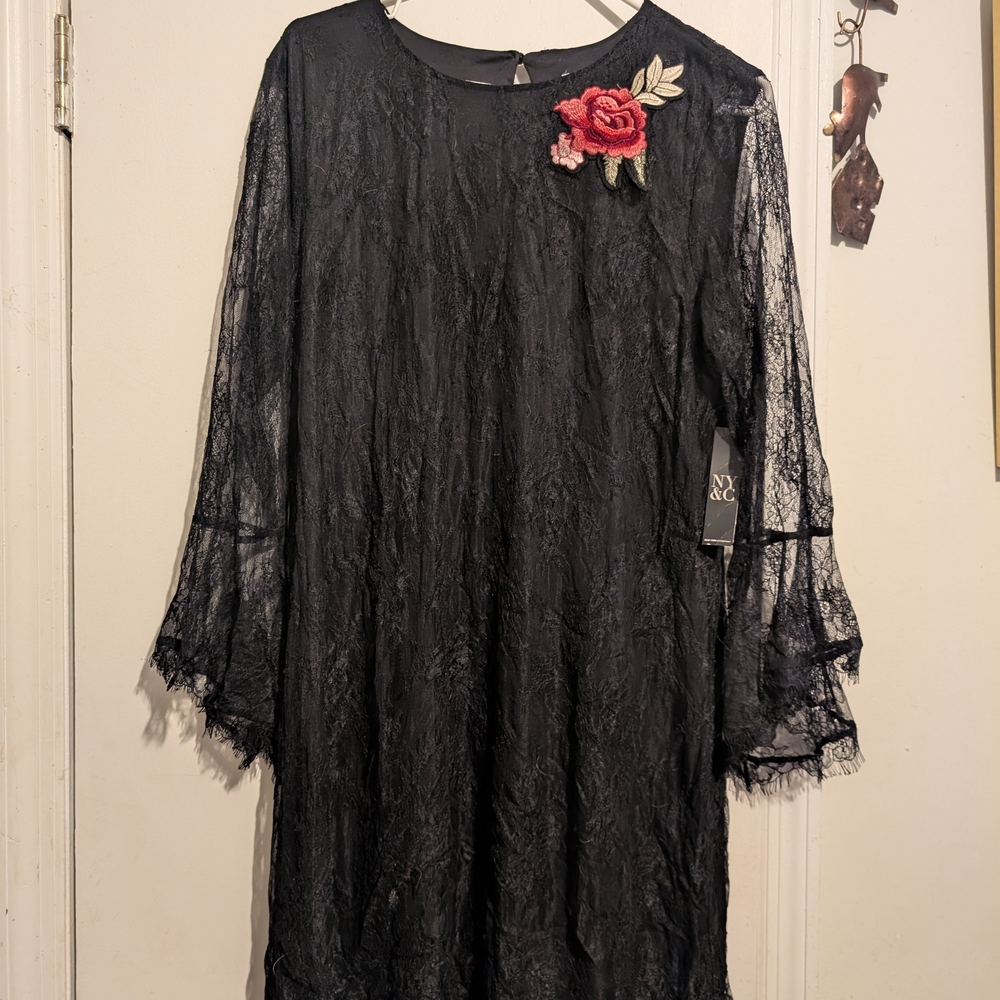 Elegant Black Lace Dress with Floral Accent